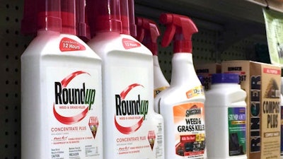 Chemical giant Monsanto has sued the nation's leading agricultural producer, saying state officials illegally based their decision for warning labels on an international health organization.