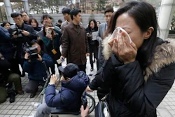 A family member of a victim of toxic humidifier disinfectants weeps during a press conference against court's sentence at the Seoul Central District Court in Seoul, South Korea, Friday, Jan. 6, 2017. A South Korean court has sentenced the former head of Oxy Reckitt Benckiser to seven years in prison after the company's disinfectant for humidifiers killed scores of people.