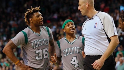 Boston Celtics' Marcus Smart (36) and Isaiah Thomas argue a call against them with referee Eric Dalen (37) during overtime of Boston's 127-123 loss to the Portland Trail Blazers in an NBA basketball game in Boston Saturday, Jan. 21, 2017.