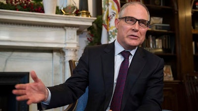 In this Jan. 4, 2017, file photo, Environmental Protection Agency (EPA) Administrator-designate Scott Pruitt answer a reporter's question during his meeting with Sen. Shelley Moore Capito, R-W.Va., on Capitol Hill in Washington. When President-elect Donald Trump’s choice to head the U.S. Environmental Protection Agency first took office as Oklahoma’s attorney general, he disbanded the unit responsible for protecting the state’s natural resources. Instead, Pruitt reassigned his staff to focus on filing lawsuits against the federal agency he’s now selected to lead.