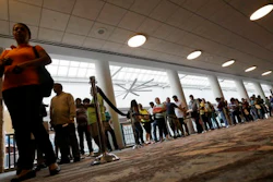 In this Sept. 3, 2014 file photo, people wait in line to sign up for unemployment in Atlantic City, N.J. The proportion of men in their prime working years who have a job has been steadily declining _ and holding back the United States’ growth potential. The full brunt of this 60-year decline became apparent during the 2016 election. Trump won the electoral college in large part by calling for more jobs at steel mills, auto plants and coal mines, the types of work that had once employed legions of men who lacked a college education.