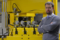 Dr. Andrew Bunger in his Benedum Hall lab with the newly installed compression frame he uses to simulate the high-stress environment deep inside the Earth.