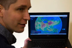 In this Jan. 13, 2017 photo, Yann Boquillod, founder of start-up AirVisual, talks about a 3-D real-time global map of air pollution at the Ivy Bilingual School in Beijing. There is no quick fix to the Chinese capital’s dirty skies, so Beijing residents are finding ways to cope with and adapt to the air pollution. Bodin said he thinks every house should have an air filtering and ventilation system pre-installed. Boquillod wanted to know what kind of air his five children were breathing at home, so he developed a portable air quality monitor.