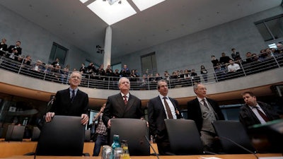 Martin Winterkorn, 2nd left front, former CEO of the German car manufacturer 'Volkswagen', and his lawyers arrive for a questioning at an investigation committee of the German federal parliament in Berlin, Germany, Thursday, Jan. 19, 2017.