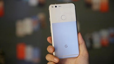 In this Tuesday, Oct. 4, 2016, file photo, the new Google Pixel phone is displayed following a product event, in San Francisco. Google’s head-on rival to the iPhone, the Pixel, is off to a modest but promising start. It is Google's first step in what it says will be a years-long effort to take on Apple where it’s strongest.