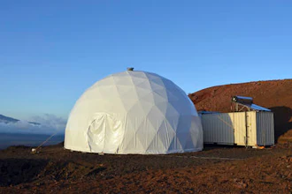 This April 25, 2013 photo provided by the University of Hawaii shows the domed structure that will house six researchers for eight months in an environment meant to simulate an expedition to Mars, on Mauna Loa on the Big Island of Hawaii. The group will enter the geodesic dome Thursday, Jan. 19, 2017, and spend eight months together in the 1,200 square foot research facility in a study called Hawaii Space Exploration Analog and Simulation (HI-SEAS). They will have no physical contact with any humans outside their group, experience a 20-minute delay in communications and are required to wear space suits whenever they leave the compound.