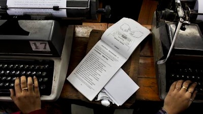 In this Jan. 17, 2017 photo, Indian students practice at a local typewriting school in New Delhi, India.