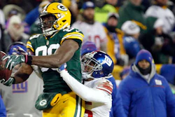 In this Sunday, Jan. 8, 2017, file photo, Green Bay Packers tight end Jared Cook (89) makes a pass reception against New York Giants defensive back Leon Hall (25) during the second half of an NFC wild-card NFL football game in Green Bay, Wis.