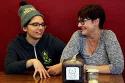 In this Jan. 9, 2017, photo, Andrea Ledesma, left, talks with her mother, Cheryl Romanowski, at Classic Slice pizza restaurant, where Ledesma works, in Milwaukee.
