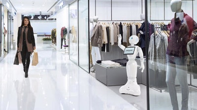 This photo provided by SoftBank Robotics America demonstrates a shopping experience with SoftBank Robotics' humanoid robot called Pepper, waving at right. The robot can greet shoppers and has the potential to send messages geared to people’s age and gender through facial recognition.