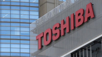 The logo of Toshiba is seen in Kawasaki near Tokyo, Friday, Jan. 27, 2017. Toshiba Corp. says it will split its lucrative flash memory business to make up for losses from its troubled U.S. nuclear business and is looking for a third-party capital injection.