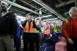 In this Tuesday, Jan. 3, 2017, file photo, Flat Rock Assembly employees clap as Ford President and CEO Mark Fields addresses the auto plant in Flat Rock, Mich.