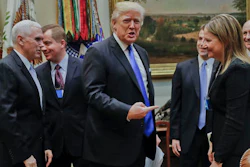 President Donald Trump gestures towards GM CEO Mary Barra, right, before the start of a meeting with automobile leaders in the Roosevelt Room of the White House in Washington, Tuesday, Jan. 24, 2017. From left are, Vice President Mike Pence, left, and Matt Blunt, president of the American Automotive Policy Council and the former governor of Missouri.