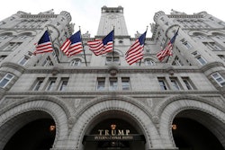 In this Dec. 21, 2106 file photo, the Trump International Hotel in Washington. An electrical subcontractor who worked on the Trump International Hotel in Washington has sued a company owned by President Donald Trump for more than $2 million, alleging it was not fully paid.