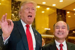 In this Tuesday, Dec. 6, 2016, file photo, President-elect Donald Trump, left, accompanied by SoftBank CEO Masayoshi Son, speaks to members of the media at Trump Tower in New York. Trump gave himself kudos for the creation of 8,000 new U.S. jobs by Japanese tech mogul Son, saying it was proof of 'the spirit and the hope' stirred by his presidential win. But for those particular jobs, Trump was basically taking a bow for the second time.