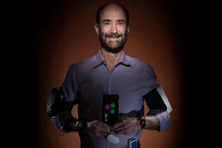 In this photo provided by Steve Fisch, Michael Snyder, professor and chair of genetics at the Stanford University School of Medicine sports wearable gadgets. Wearable gadgets gave a Snyder an early warning that he was getting sick before he ever felt any symptoms of Lyme disease.