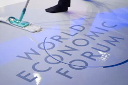 A woman cleans the stage prior to a panel session on the closing day of the 47th annual meeting of the World Economic Forum, WEF, in Davos, Switzerland, Friday, Jan. 20, 2017.