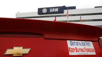 In this Dec. 12, 2008 file photo, a bumper sticker is displayed on a Chevrolet outside the United Auto Workers headquarters in Detroit. The UAW union is working on an advertising campaign that urges people to buy U.S.-made cars and trucks in an effort to build on what the union sees as nationalistic sentiment that President Donald Trump tapped into during the election.