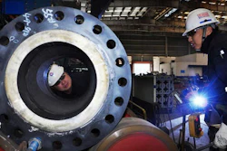 Workers make inspections at a builder of offshore platforms in Qingdao in east China's Shandong province Wednesday, Feb. 1, 2017. Chinese manufacturing expanded in January at close to its fastest pace in two years as heavy government spending and a bank lending boom helped to keep economic activity steady headed into 2017, a survey showed Wednesday.