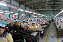 Pictured above, workers in a Myanmar garment factory. Yesterday, a dispute at a different Myanmar garment factory resulted in several staffers being held captive for hours.