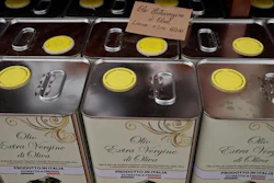 Cans of Italian extra virgin olive oil are on sale at the Iannotta family olive oil farm's shop, in Capocroce, Italy, Thursday, Feb. 16, 2017. From specialty shops in Rome to supermarkets around the world, fans of Italian olive oil are in for a surprise this year as prices are due to jump by as much as 20 percent.
