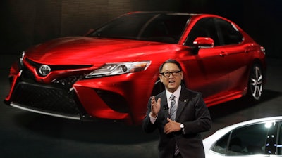 In this Jan. 9, 2017 photo, Toyota President Akio Toyoda introduces the 2018 Toyota Camry at the North American International Auto show in Detroit.