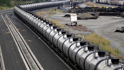More crude oil than ever is expected to move through Washington state, particularly since the Canadian government approved the Kinder Morgan pipeline project that will triple the number of tankers and barges plying local waters. This photo shows an idled train of oil tankers.