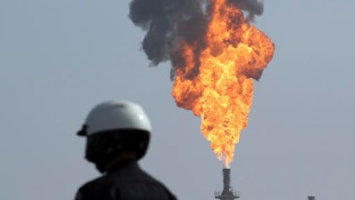 In this Feb. 18, 2015, file photo, a very large smokestack flare burns off flammable product after an explosion in a processing facility at the ExxonMobil refinery in Torrance, Calif. An explosion and fire at this oil refinery near Los Angeles, exactly two years after a blast that crippled the plant and led to higher gasoline prices. Torrance Assistant Fire Chief Steve Treskes says the explosion was reported early Saturday, Feb. 18, 2017, but three dozen firefighters had the blaze knocked down within a half-hour. No injuries are reported and there were no evacuations.