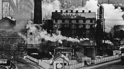 In this September 1980 file photo, a Jones and Laughlin Steel Corp. coke plant is wreathed in smoke and steam in Struthers, Ohio. Republican Ohio Gov. John Kasich has made it his mission to send Ohio's 'Rust Belt' label to the scrap heap of history, but it's been repeated and entrenched over more than 30 years since the steel industry's devastation in the 1970s and 1980s by foreign competition and environmental regulation, leaving behind abandoned, rusting mills and unemployment.