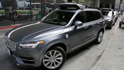 In this Dec. 13, 2016 file photo, an Uber driverless car heads out for a test drive in San Francisco. In the first major congressional attempt to address the advent of self-driving cars, two key senators said Monday, Feb. 13, 2017, they’re launching a bipartisan effort to help to speed up the deployment of the vehicles on the nation’s roads.
