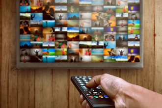 Smart Tv And Hand Pressing Remote Control 520364452 1258x838 58b597ae0f9e8