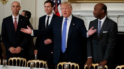 President Donald Trump welcomes manufacturing executives to a meeting at the White House in Washington, Thursday, Feb. 23, 2017. From left are, Archer Daniels Midland CEO Juan Luciano, White House Senior Adviser Jared Kushner, Trump, and Merck CEO Kenneth Frazier.