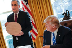 President Donald Trump looks at Intel CEO Brian Krzanich, holding a silicon wafer, during their meeting in the Oval Office of the White House in Washington, Wednesday, Feb. 8, 2017.