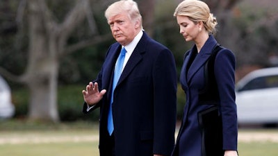 In this Feb. 1, 2017, file photo, President Donald Trump, accompanied by his daughter Ivanka, waves as they walk to board Marine One on the South Lawn of the White House in Washington. According to officials, Ivanka Trump, who has been a vocal advocate for policies benefiting working women, was involved in recruiting participants for a round table discussion that will be held Monday, Feb. 13, about women in the workforce. President Donald Trump and Canadian Prime Minister Justin Trudeau will participate in the round table.