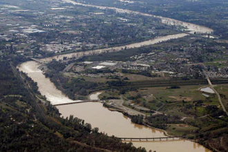 The water from the Feather River flows through Oroville, Calif., Monday, Feb. 13, 2017. Water levels at Lake Oroville, which feeds the river are continuing to drop, stopping water from spilling over the spillway. Thousands of Northern California residents were asked to evacuate their homes Sunday evening after authorities warned the emergency spillway of the Oroville Dam could fail at any time unleashing uncontrolled flood waters on towns below.