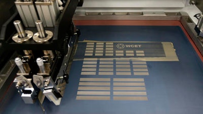 A machine that can print electrical circuits and solar cells is shown at the newly opened Washington Clean Energy Testbeds lab housed in the University of Washington's Clean Energy Institute, Monday, Feb. 13, 2017 in Seattle.