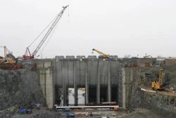 In this Feb. 6, 2015, file photo the auxiliary spillway is under construction at Folsom Dam, in Folsom, Calif. Twelve years ago, widespread destruction from Hurricane Katrina on the Gulf Coast helped compel federal engineers to spend nearly $1 billion constructing the auxiliary spillway at Folsom Dam, scheduled to be completed in 2017.