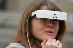 In this photo taken Thursday, Feb. 2, 2017, Yvonne Felix wears eSight electronic glasses and looks around Union Square during a visit to San Francisco. The glasses enable the legally blind to see. Felix was diagnosed with Stargardt’s disease after being hit by a car at the age of seven.
