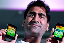 In this July 7, 2016 file photo, Mohit Goel, Director of Indian company Ringing Bells Pvt. Ltd. shows Freedom 251 smartphones at a press conference in New Delhi, India. Police say Mohit Goel was arrested late Thursday in the northern town of Ghaziabad following a complaint that his company, Ringing Bells, had not supplied the handsets that a phone distribution company had paid for.