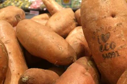In this photo taken on Tuesday Jan. 31, 2017, laser branded sweet potatoes are displayed at the ICA Kvantum supermarket in Malmo, Sweden. Something high-tech is happening in the produce aisle at some Swedish supermarkets, where laser marks have replaced labels on the organic avocados and sweet potatoes.