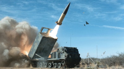 A TACMS long-range missile takes flight from a Lockheed Martin M270A1 launcher during a test.