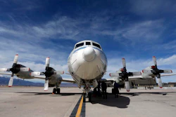 This Feb. 17, 2017, photo shows a Navy P-3 Orion aircraft used for a NASA-led experiment called SnowEx, on an airfield at Peterson Air Force Base in Colorado Springs, Colo. Instrument-laden aircraft are surveying the Colorado high country this month as scientists search for better ways to measure how much water is locked up in the world's mountain snows - water that sustains a substantial share of the global population.