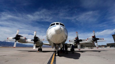This Feb. 17, 2017, photo shows a Navy P-3 Orion aircraft used for a NASA-led experiment called SnowEx, on an airfield at Peterson Air Force Base in Colorado Springs, Colo. Instrument-laden aircraft are surveying the Colorado high country this month as scientists search for better ways to measure how much water is locked up in the world's mountain snows - water that sustains a substantial share of the global population.