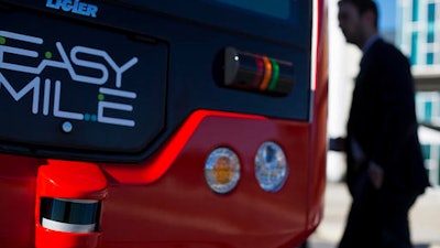 In this Thursday, Jan. 26, 2017 photo, a sensor, bottom left, is seen on the front of a driverless shuttle bus on display at the Riverside EpiCenter in Austell, Ga. Self-driving vehicles could begin tooling down a bustling Atlanta street full of cars, buses, bicyclists and college students, as the city vies with other communities nationwide to test the emerging technology.