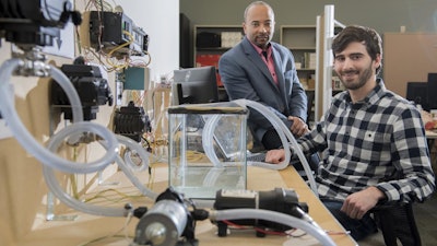 Georgia Tech researchers have developed a new form of ransomware that can take over control of a simulated water treatment plant. The simulated attack was designed to highlight vulnerabilities in the control systems used to operate industrial facilities. Shown are (left) Raheem Beyah, associate chair in the Georgia Tech School of Electrical and Computer Engineering, and David Formby, a Georgia Tech Ph.D. student.