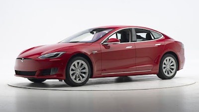 This Sept. 7, 2016, photo provided by the Insurance Institute for Highway Safety shows a Tesla Model S before crash safety testing. The car earned good ratings in four of the institute’s five tests, but fell short of getting the highest safety rating in the newest crash tests administered by the insurance industry.