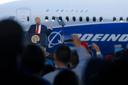 President Donald Trump speaks to Boeing employees, Friday, Feb. 17, 2017, in the final assembly building at Boeing South Carolina in North Charleston, S.C. The president visited the plant where Boeing rolled out the first 787-10 Dreamliner aircraft from its assembly line seen in back.