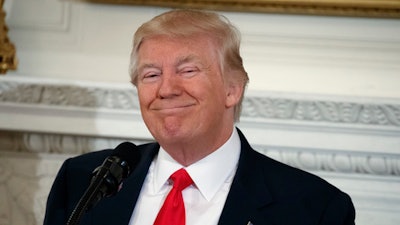 President Donald Trump smiles while speaking to a meeting of the National Governors Association, Monday, Feb. 27, 2017, at the White House in Washington.