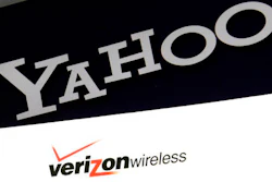 This Monday, July 25, 2016, file photo shows the Yahoo and Verizon logos on a laptop, in North Andover, Mass. Yahoo is taking a $350 million hit on its previously announced $4.8 billion sale to Verizon in a concession for security lapses that exposed personal information stored in more than 1 billion Yahoo user accounts. The revised agreement announced Tuesday, Feb. 21, 2017, eases investor worries that Verizon Communications Inc. would demand a discount of at least $1 billion or cancel the deal entirely.