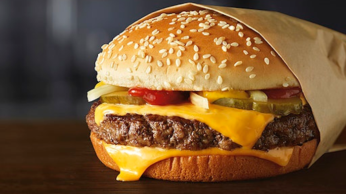 This image provided by McDonald’s Corporation shows a Quarter Pounder burger. McDonald's says it will swap frozen beef patties for fresh ones in its Quarter Pounder burgers by sometime in 2018 at most of its U.S. locations. Employees will cook up the never-frozen beef on a grill when ordered.
